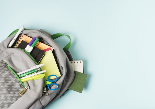 opened_backpack_with_school_supplies