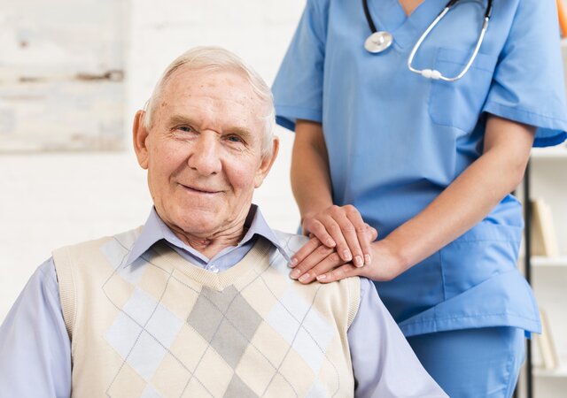 caregiver_holding_old_man_s_shoulder