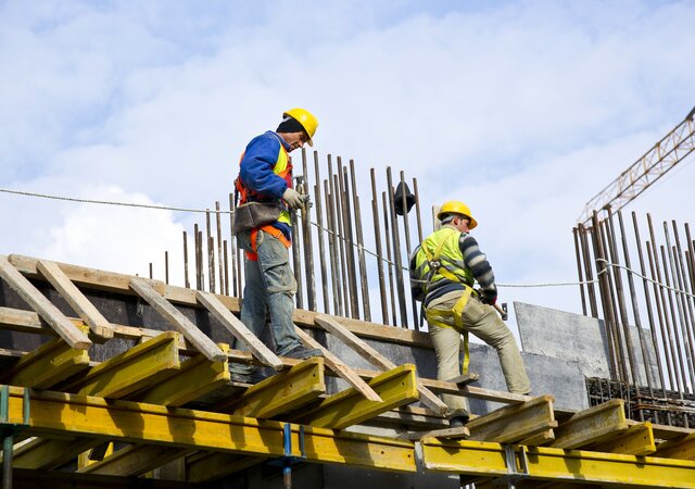 workers_examining_work