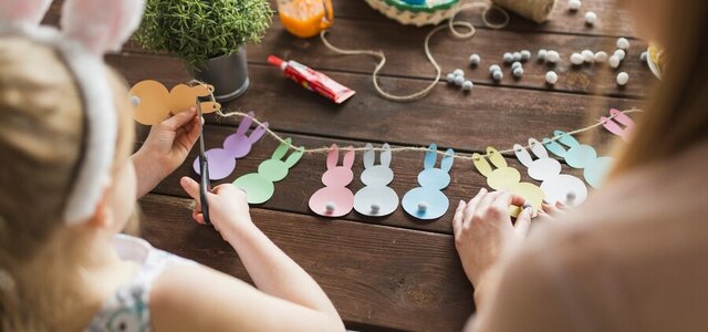 mother_daughter_cutting_bunnies_from_paper_23_2147760628